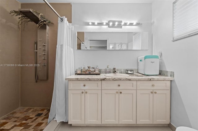 bathroom featuring vanity and walk in shower