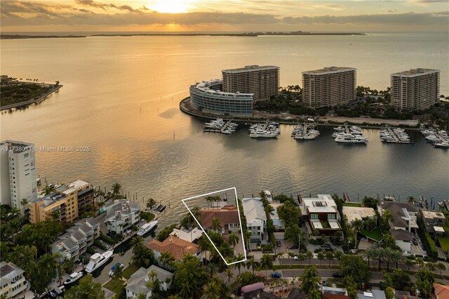 1740 S Bayshore Ln, Miami, FL 33133 - aerial view at dusk featuring a water view