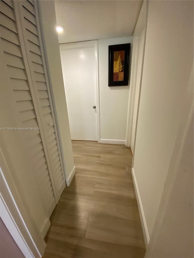 corridor featuring light hardwood / wood-style flooring