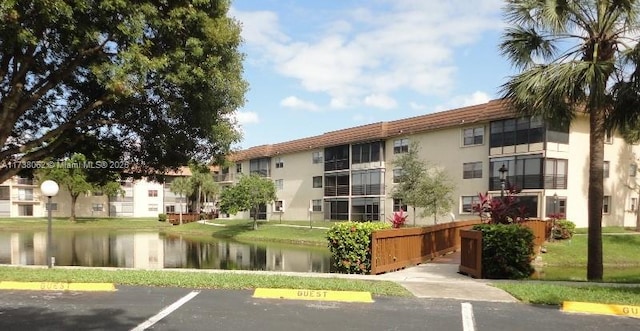 view of building exterior with a water view