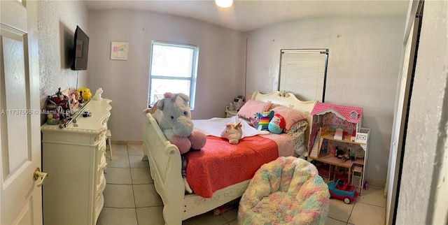 bedroom featuring light tile patterned floors