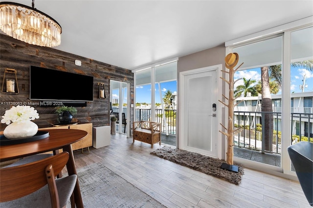 interior space with light hardwood / wood-style flooring and floor to ceiling windows