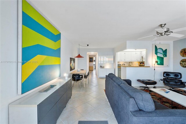 143 Oakridge J 143, Deerfield Beach, FL 33442 - living area featuring light tile patterned floors and a ceiling fan