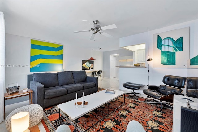 living room with ceiling fan and light tile patterned flooring