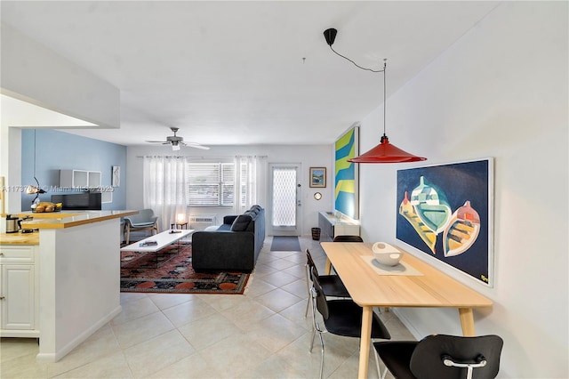 tiled living room featuring ceiling fan