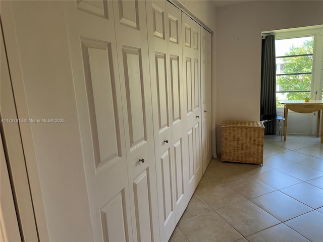 hallway featuring light tile patterned floors