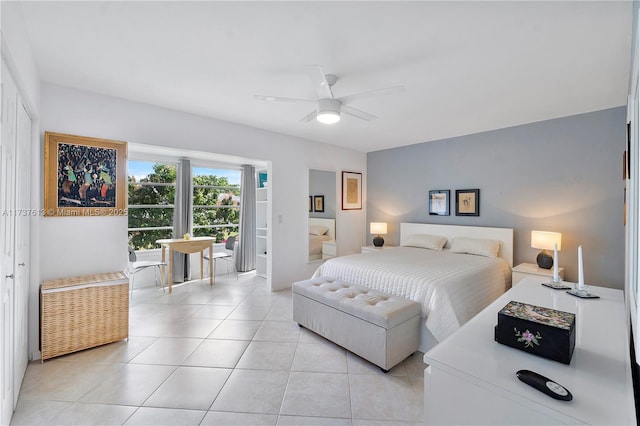 bedroom with light tile patterned floors, access to outside, and a ceiling fan