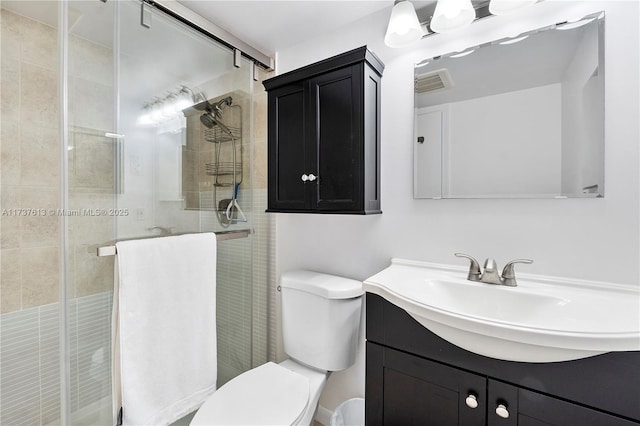 bathroom featuring visible vents, toilet, and a stall shower