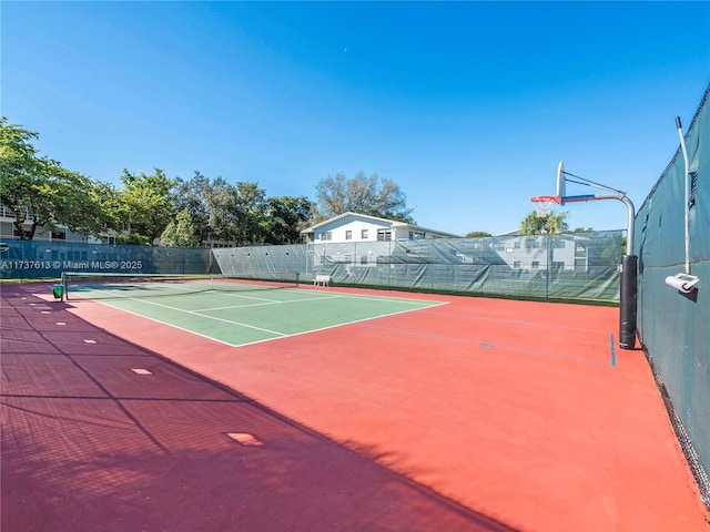 view of sport court featuring community basketball court and fence