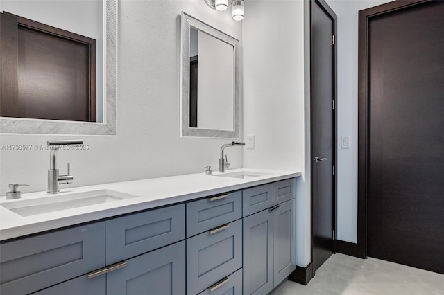 full bathroom featuring a sink and double vanity