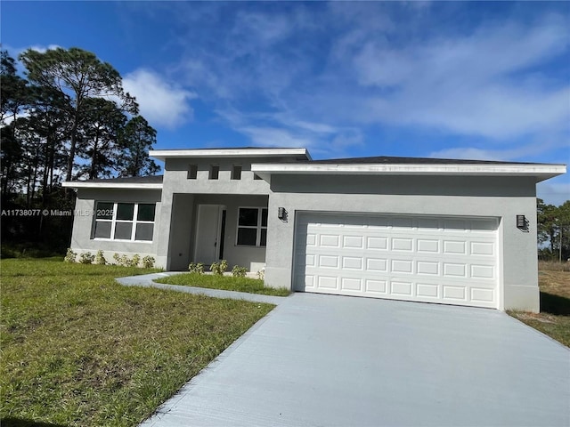 view of front of property featuring stucco siding, driveway, a front yard, and an attached garage