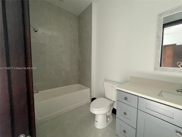 bathroom with vanity, toilet, and shower / tub combination