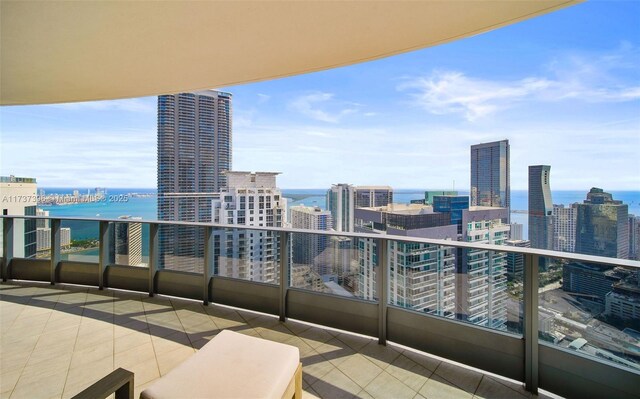 balcony featuring a water view