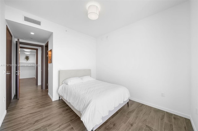 bedroom featuring hardwood / wood-style floors