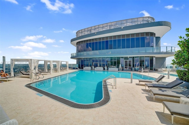 view of pool featuring a patio