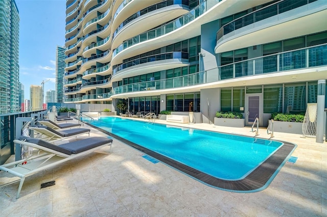 view of swimming pool featuring a patio