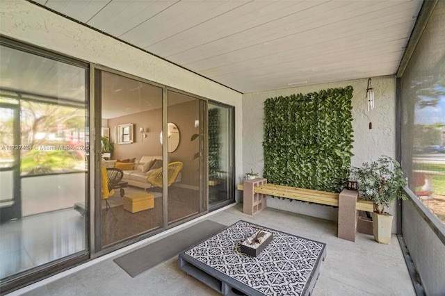 sunroom / solarium featuring wooden ceiling