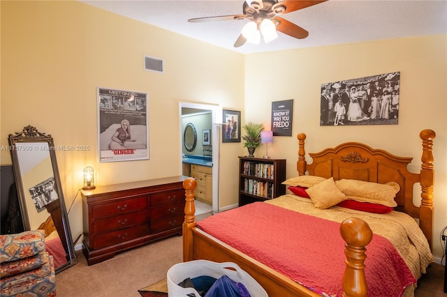 carpeted bedroom featuring connected bathroom and ceiling fan