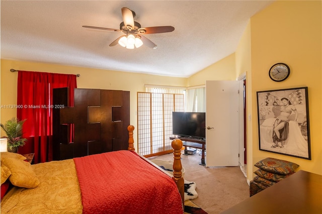 bedroom with lofted ceiling, ceiling fan, a textured ceiling, and carpet