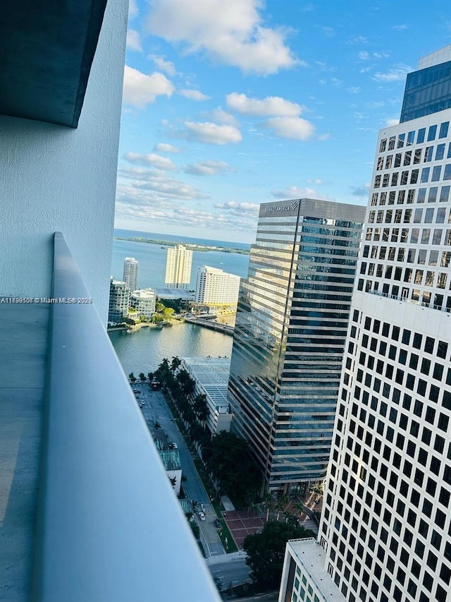 balcony featuring a water view