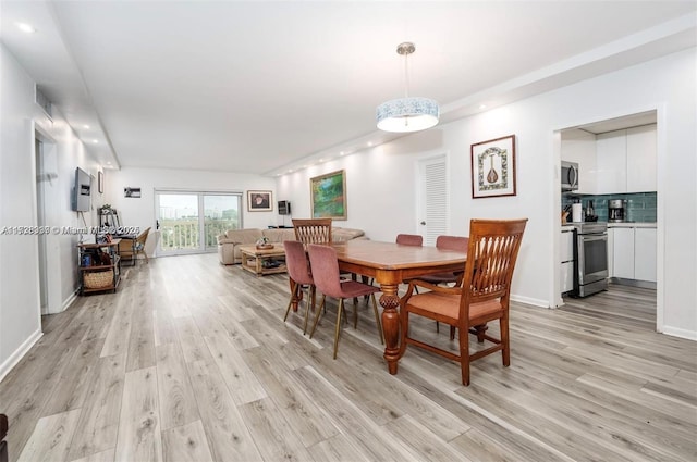 dining room featuring light wood-type flooring