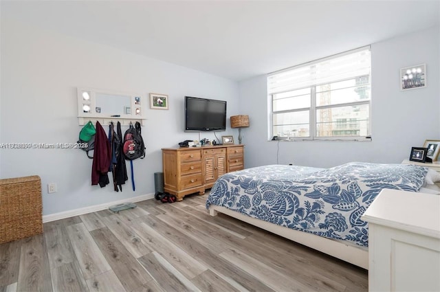 bedroom with light hardwood / wood-style floors