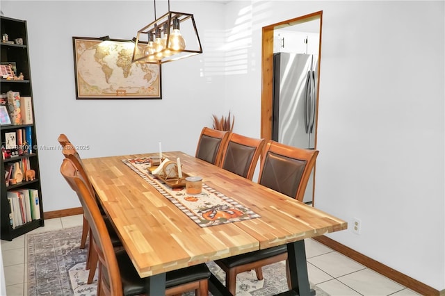 dining space featuring light tile patterned floors