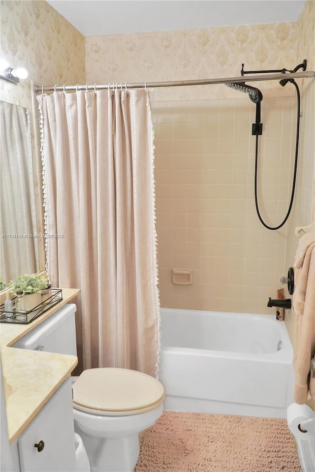 full bathroom with shower / tub combo with curtain, vanity, and toilet