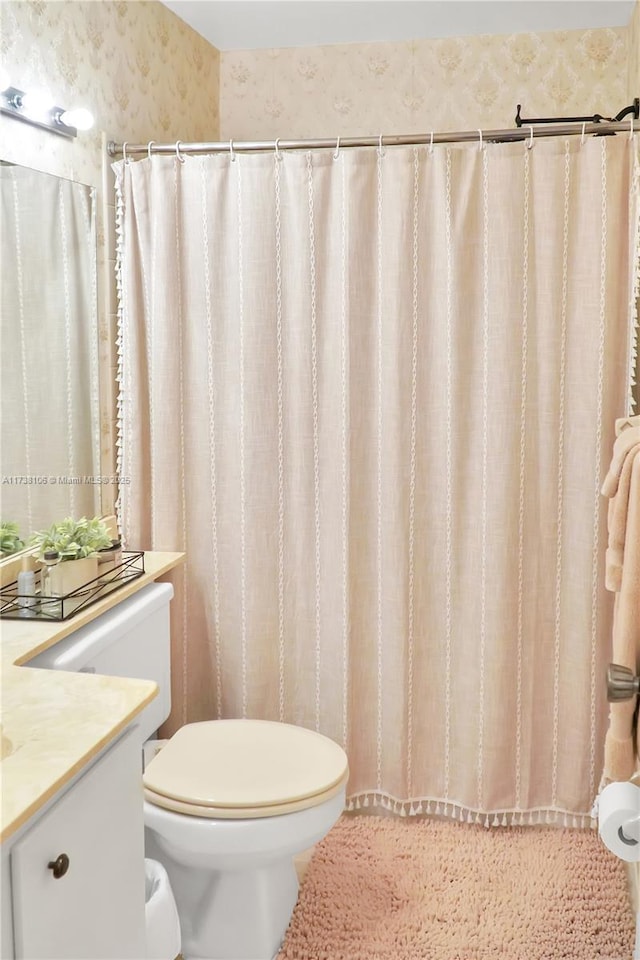 bathroom with vanity and toilet