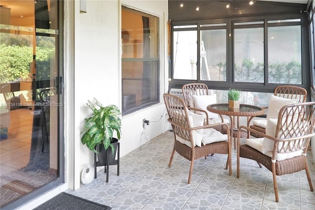 sunroom / solarium featuring plenty of natural light