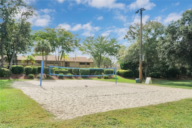 view of home's community with a yard and volleyball court