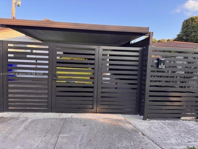 view of gate featuring fence