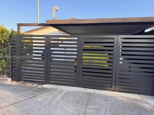 view of gate featuring fence