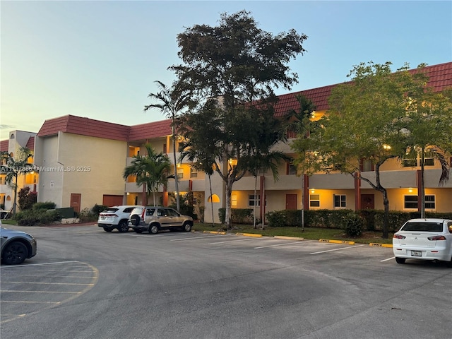 view of outdoor building at dusk