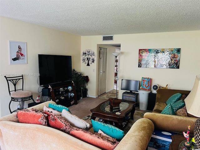 carpeted living room with a textured ceiling