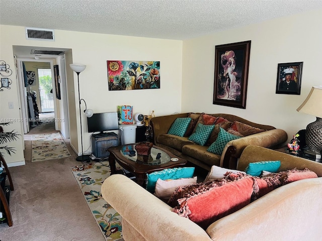 living room with light carpet and a textured ceiling