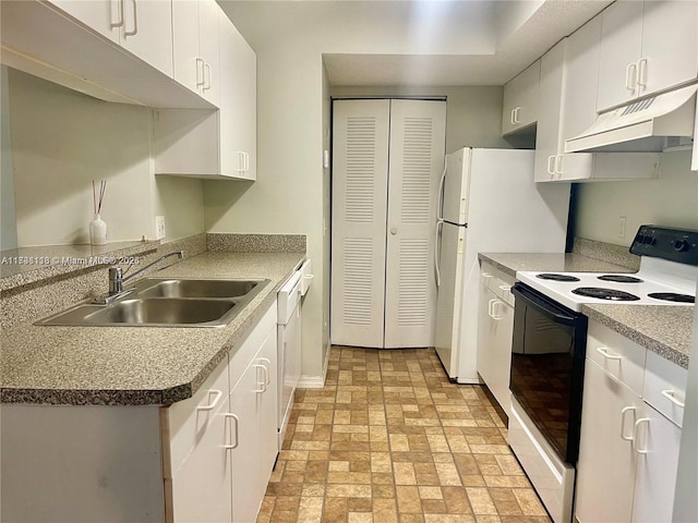 kitchen with sink, white appliances, and white cabinets