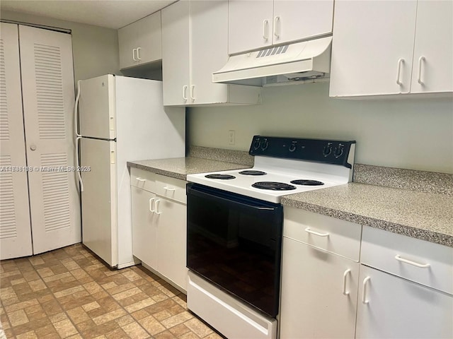 kitchen featuring white cabinets, white fridge, and range with electric stovetop