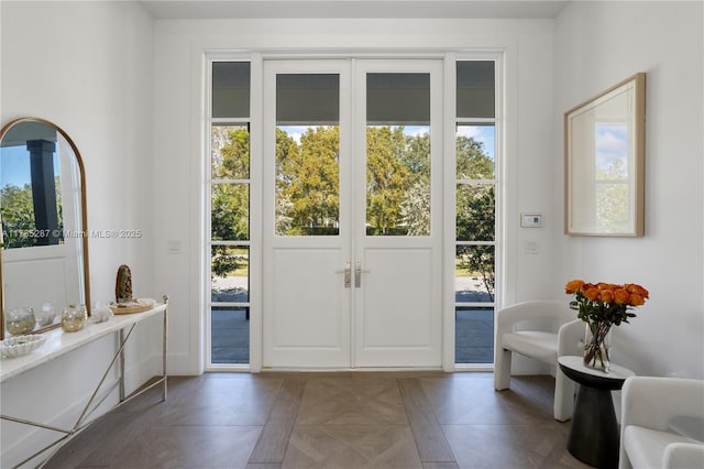 doorway with dark parquet floors