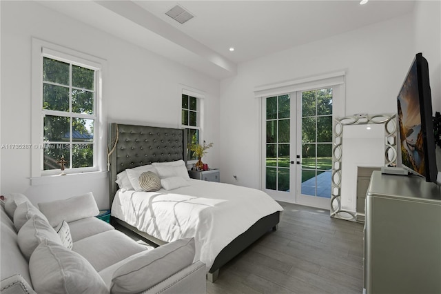 bedroom with french doors, hardwood / wood-style floors, and access to outside