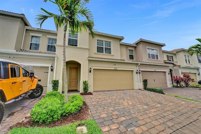 townhome / multi-family property featuring a garage