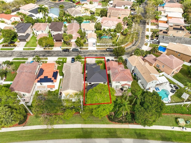 birds eye view of property with a residential view