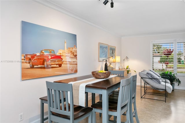 dining room with crown molding