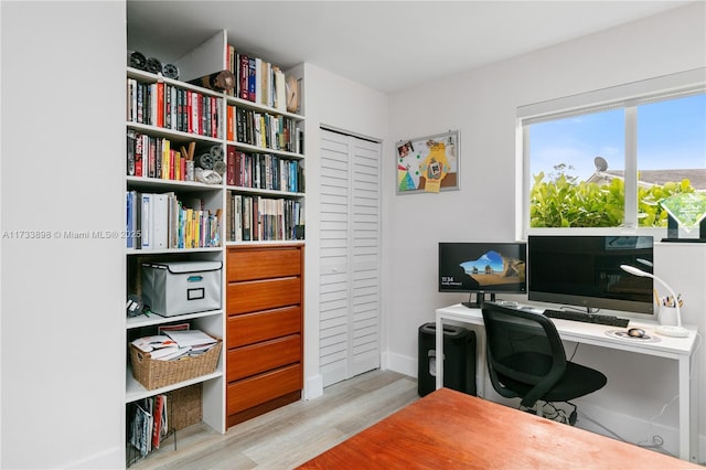 office space with light wood-type flooring