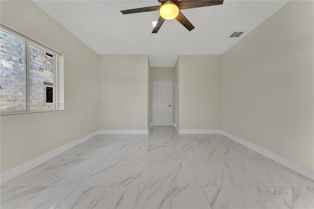 empty room featuring ceiling fan