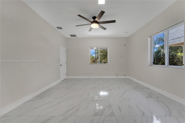 unfurnished room with ceiling fan