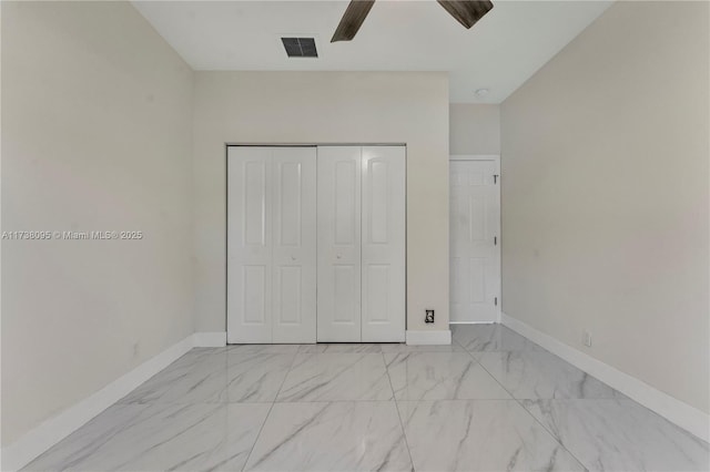 unfurnished bedroom with a closet and ceiling fan