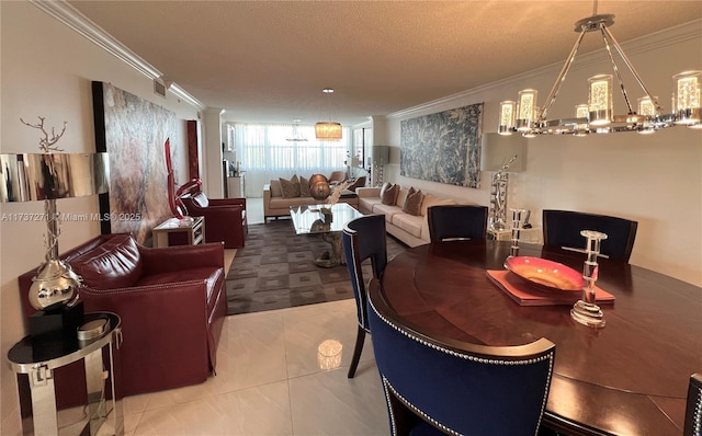 dining area featuring crown molding, a textured ceiling, and ornate columns