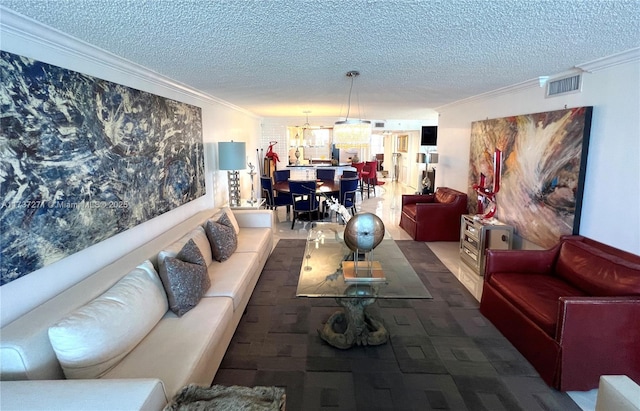 living room featuring crown molding and a textured ceiling