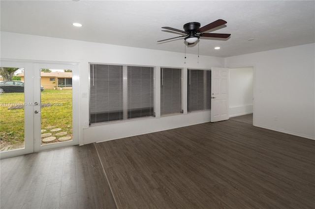 empty room featuring a healthy amount of sunlight, a ceiling fan, wood finished floors, and recessed lighting